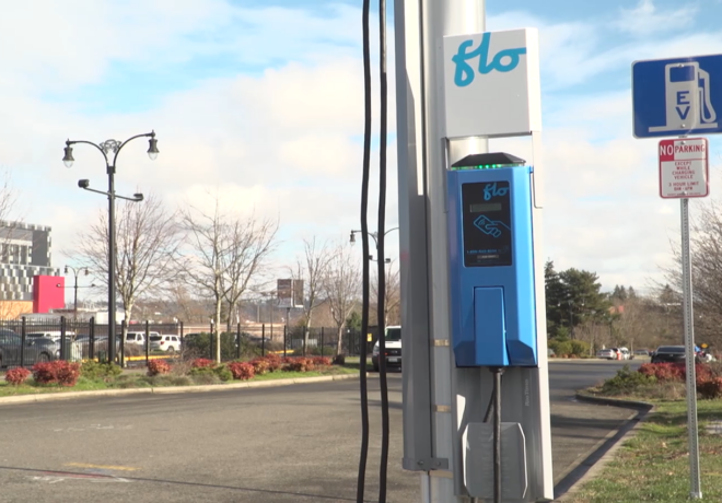 Image of a flow charger installed on the side of a street connected to a power pole