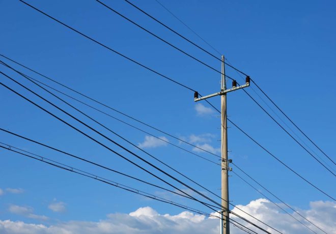 Picture of powerlines on a utility pole.