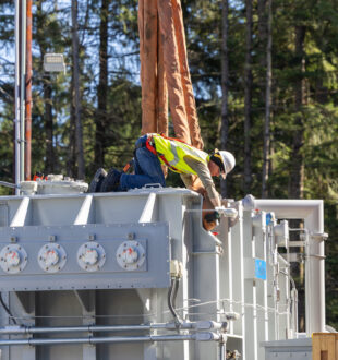 An image of a Wire Apprentice helping install a transformer at a substation
