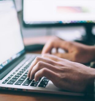 Person typing on a computer